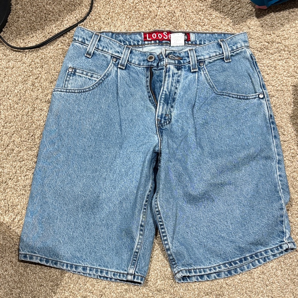 This is a vintage Levi's SilverTab loose-fit denim shorts.